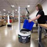 Karen Leavitt, a Locus Robotics employee, used a LocusBot to transport warehouse items during a demonstration at the company?s headquarters in Wilmington.