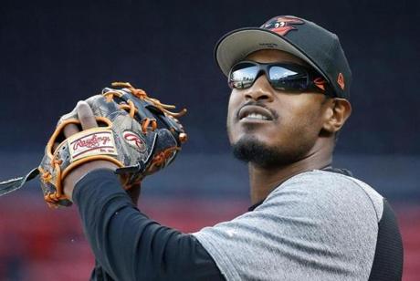Orioles outfielder Adam Jones warmed up before Tuesday?s game at Fenway Park.

