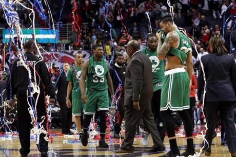 Washington, D.C. - 5/04/2017 - (4th quarter) The Boston Celtics head to the showers as the confetti rained down celebrating the Washington Wizards wizards 116-89 win to take Game 3 over the Boston Celtics. The Washington Wizards host the Boston Celtics in Game 3 of the Eastern Conference Semi-Finals at the Verizon Center in Washington, D.C. - (Barry Chin/Globe Staff), Section: Sports, Reporter: Adam Himmelsbach, Topic: 05Celtics-Wizards, LOID: 8.3.2398463528.
