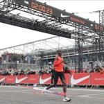 Olympic marathon champion Eliud Kipchoge crosses the finish line of a marathon race at the Monza Formula One racetrack, Italy, Saturday, May 6, 2017. Kipchoge was 26 seconds from making history on Saturday but in the end the Olympic champion was just short of becoming the first person to run a marathon in less than two hours. Kipchoge ran the 26.2 miles (42.2 kilometers) in 2 hours and 25 seconds, beating Dennis Kimetto's world record of 2:02:57, but the Kenyan failed to run the first sub-two hour marathon. (AP Photo/Luca Bruno)