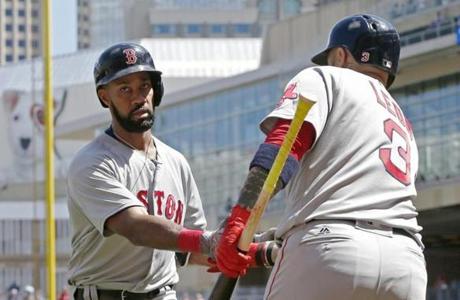 Boston Red Sox's Chris Young, left, is congratulated by Sandy Leon after hitting a home run off Minnesota Twins pitcher Drew Rucinski in the fifth inning of a baseball game Saturday, May 6, 2017, in Minneapolis. Young also homered in the second inning. (AP Photo/Jim Mone)
