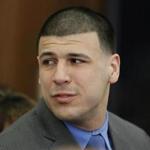 FILE - In this Friday, April 14, 2017, file photo, Former New England Patriots tight end Aaron Hernandez turns to look toward his fiancee Shayanna Jenkins Hernandez as he reacts to his double murder acquittal at Suffolk Superior Court in Boston. Hernandez?s family is planning a private funeral for the former NFL star in his hometown in Bristol, Conn. A spokeswoman for the Connecticut Funeral Directors Association said Saturday, April 22, that the service is set for Monday, April 24. The former New England Patriots tight end was found hanged in his cell in a maximum-security prison in Massachusetts early Wednesday, April 19. (AP Photo/Stephan Savoia, Pool, File)