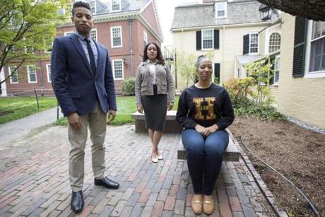 Cambridge, MA - 5/8/2017 -Harvard graduate students Michael Huggins(L), Courtney Woods, and Jillian M. Simons(R) pose for a portrait on the campus of the university in Cambridge, MA, May 8, 2017. The graduate students will take part in a Harvard Black Commencement Ceremony. (Keith Bedford/Globe Staff)
