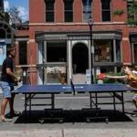 David Gilo and son Nicholas played Ping-Pong in the middle of Newbury Street last summer. 