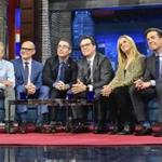 In this photo provided by CBS, host Stephen Colbert, third from right, sits with guests, from left, Jon Stewart, Rob Corddry, John Oliver, Samantha Bee, and Ed Helms during 