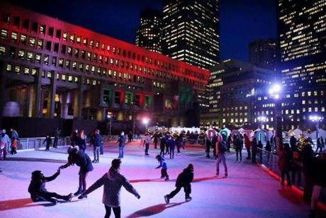Boston, MA - December 21, 2016: Skaters fill the ice at 