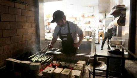 Bruno Cruciani cooked over a grill in the kitchen of Shepard in Cambridge.
