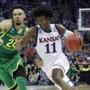 KANSAS CITY, MO - MARCH 25: Josh Jackson #11 of the Kansas Jayhawks is defended by Dillon Brooks #24 of the Oregon Ducks during the 2017 NCAA Men's Basketball Tournament Midwest Regional at Sprint Center on March 25, 2017 in Kansas City, Missouri. (Photo by Ronald Martinez/Getty Images)