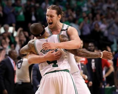 Boston, MA - 5/15/2017 - (4th quarter) Boston Celtics center Kelly Olynyk (41) embraces Isaiah Thomas who provided the assist on Olynyk's three pointer to give the Celtics a 110-100 lead during the fourth quarter. The Boston Celtics host the Washington Wizards in Game 7 of the Eastern Conference Semi-Finals at TD Garden. - (Barry Chin/Globe Staff), Section: Sports, Reporter: Adam Himmelsbach, Topic: 16Celtics-Wizards, LOID: 8.3.2508922496.
