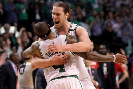 Boston, MA - 5/15/2017 - (4th quarter) Boston Celtics center Kelly Olynyk (41) embraces Isaiah Thomas who provided the assist on Olynyk's three pointer to give the Celtics a 110-100 lead during the fourth quarter. The Boston Celtics host the Washington Wizards in Game 7 of the Eastern Conference Semi-Finals at TD Garden. - (Barry Chin/Globe Staff), Section: Sports, Reporter: Adam Himmelsbach, Topic: 16Celtics-Wizards, LOID: 8.3.2508922496.
