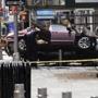Emergency workers investigate the scene of a car that crashed into pedestrians in New York?s Times Square on Thursday.