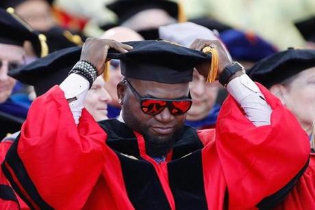 Former Boston Red Sox player David Ortiz adjusted his cap during Boston University Commencement, where he was awarded an honorary degree. 
