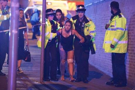 Manchester, UK. Police and other emergency services are seen near the Manchester Arena after reports of an explosion. Police have confirmed they are responding to an incident during an Ariana Grande concert at the venue. Reported Explosion at Manchester Arena, UK - 22 May 2017 (Rex Features via AP Images)
