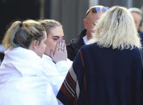 A woman left a hotel in Manchester, England, on Tuesday. Many hotels in the city housed people who were stranded after Monday?s explosion at an Ariana Grande concert.
