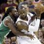 Cleveland Cavaliers' LeBron James, right, backs down Boston Celtics' Jae Crowder (99) during the first half of Game 3 of the NBA basketball Eastern Conference finals, Sunday, May 21, 2017, in Cleveland. (AP Photo/Tony Dejak)