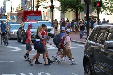 A group crossed Washington Street in Boston last week against traffic and outside the crosswalk.
