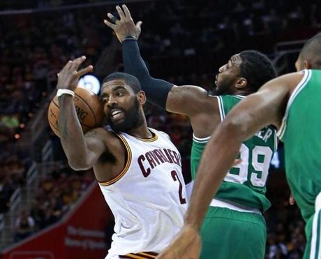 Cleveland, OH May 23, 2017: The Cavaliers Kyrie Irving loses control of the ball as he is guarded by the Celtics Jae Crowder in the first half. The Boston Celtics played Game Four of their NBA Eastern Conference Finals playoff series vs. the Cleveland Cavaliers at the Quicken Loans Arena. (Globe Staff Photo/Jim Davis) 

