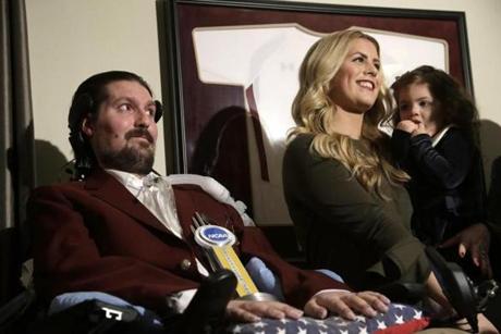 Pete Frates with his wife, Julie, and 2-year-old daughter, Lucy, when Frates was presented with the 2017 NCAA Inspiration Award in December.
