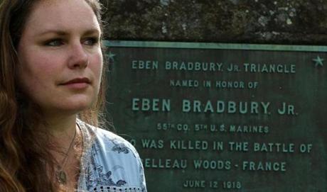 Bethany Groff Dorau, a local historian, at the site honoring Eben Bradbury Jr. Triangle, located at Bartlett Mall in Newburyport. The plaque honors the first local resident to die in the Great War in the Battle of Belleau Wood. Mark Lorenz for the Boston Globe. 
