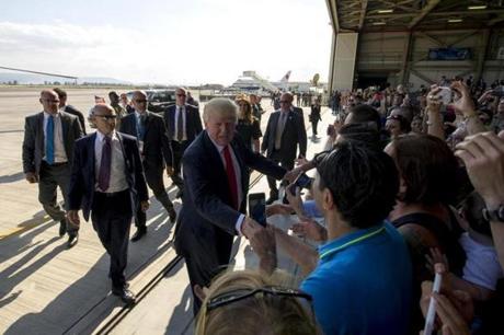 SIGONELLA, ITALY - MAY 27: In this handout provided by U.S. Navy, U.S. President Donald J. Trump shakes hands with service members and their families at Naval Air Station Sigonella prior to an all-hands call May 27, 2017 in Sigonella, Italy. This visit marks President Trump's last stop of his first trip abroad since taking office. (Photo by Mass Communication Specialist 2nd Class Christopher Gordon/U.S. Navy via Getty Images)
