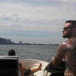 Daniel Cleggett on his boat in Boston harbor.