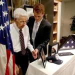 WWII veteran John F. Hurley got a helping hand from US Rep. Joseph P. Kennedy III after Kennedy presented him with medals he earned in Okinawa.
