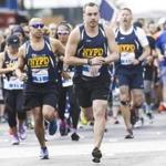 Boston, MA - 5/28/2017 - Runners from the NYPD team make their way along the route of the Run To Remember , a charity race honoring first responders killed in the line of duty, in Boston, MA, May 28, 2017. (Keith Bedford/Globe Staff)