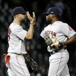 Boston Red Sox's Deven Marrero, left, and Jackie Bradley Jr. celebrate the Red Sox's 13-7 win over the Chicago White Sox after a baseball game Tuesday, May 30, 2017, in Chicago. (AP Photo/Charles Rex Arbogast)