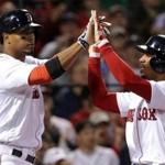 Boston, MA - 5/24/2017 - (7th inning) Boston Red Sox shortstop Xander Bogaerts high fives Boston Red Sox right fielder Mookie Betts after Betts scored during a seven run scoring seventh inning. The Boston Red Sox host the Texas Rangers in the second of a three game series at Fenway Park. - (Barry Chin/Globe Staff), Section: Sports, Reporter: Peter Abraham, Topic: 25Sox-Rangers, LOID: 8.3.2576713733.