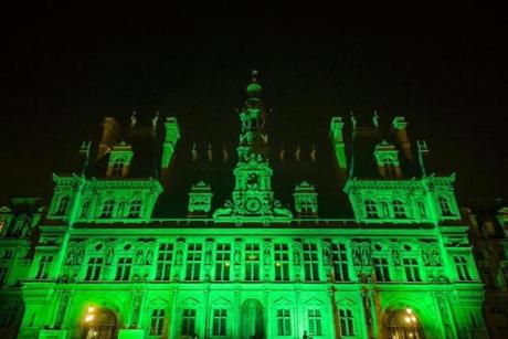 epa06004659 The Paris City Hall is illuminated on green to mark the disapproval of the French capital and its mayor Anne Hidalgo after the decision of US President Donald J. Trump to withdraw from the Paris Climate Agreement, in Paris, France, 01 June 2017. According to media reports on 01 June 2017, US President Trump withdrew the USA from the Paris Climate Agreement. EPA/CHRISTOPHE PETIT TESSON
