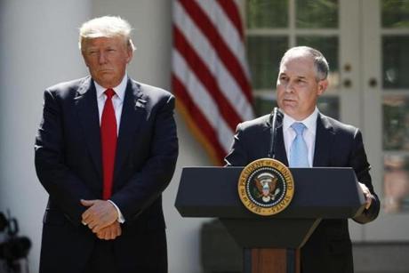 President Donald Trump listens as EPA Administrator Scott Pruitt speaks about the U.S. role in the Paris climate change accord, Thursday, June 1, 2017, in the Rose Garden of the White House in Washington. (AP Photo/Pablo Martinez Monsivais)
