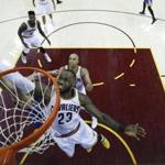 Cleveland Cavaliers forward LeBron James (23) reaches for the ball against the Golden State Warriors during the second half of Game 4 of basketball's NBA Finals in Cleveland, Friday, June 9, 2017. Cleveland won 137-116. (Larry W. Smith/Pool Photo via AP)