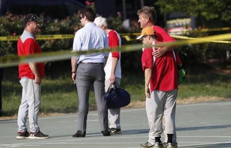 SHOOTING SLIDER epa06027933 Republican Senator from Arizona Jeff Flake (R) hugs another member of the Republican congressional baseball team following a shooting in Alexandria, Virginia, USA, 14 June 2017. The Republican House majority whip Steve Scalise and at least four others have been shot shot at a congressional baseball game practice session, according to media reports. EPA/SHAWN THEW
