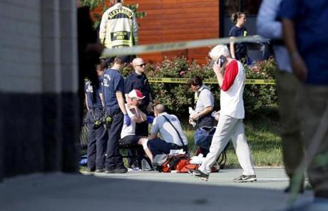 SHOOTING SLIDER epa06027939 A person is treated by emergency workers as members of the Republican congressional baseball team look on following a shooting in Alexandria, Virginia, USA, 14 June 2017. The Republican House majority whip Steve Scalise and at least four others have been shot shot at a congressional baseball game practice session, according to media reports EPA/SHAWN THEW
