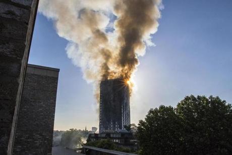 LONDON FIRE SLIDER Smoke billows from a high-rise apartment building in west London Wednesday, June 14, 2017. A massive fire raced through the building early Wednesday, emergency officials said. (Rick Findler/PA via AP)
