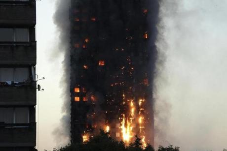 LONDON FIRE SLIDER Smoke and flames rise from building on fire in London, Wednesday, June 14, 2017. Firefighters are battling a massive fire in an apartment high-rise in London. (AP Photo/Matt Dunham)
