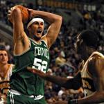 Boston Celtics Vitaly Potapenko (C) sets up for a shot against Seattle Supersonics Brent Barry (L) and Desmond Mason (R) in Seattle, 16 February 2002. AFP PHOTO/DAN LEVINE -- Library Tag 02172002 Sports Library Tag 02062003 Sports