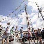 Crowds made their way along Fan Pier to tour ships that were taking part of Sail Boston in Boston on Sunday.