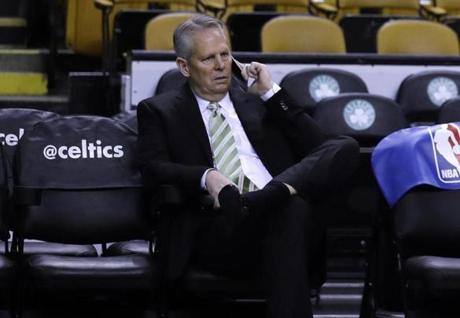 Boston Bruins General Manager Danny Ainge talks on the phone before an NBA basketball game in Boston, Wednesday, March 1, 2017. (AP Photo/Charles Krupa)

