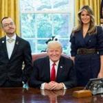 Nikos Giannopoulos (left) posed with President Donald Trump and Melania Trump in the Oval Office. 