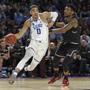 FILE - In this March 19, 2017, file photo, Duke's Jayson Tatum, left, drives past South Carolina's Chris Silva during the first half in a second-round game of the NCAA men's college basketball tournament, in Greenville, S.C. Tatum spent one season at Duke and is expected to be a top-five pick in Thursday's NBA draft. (AP Photo/Rainier Ehrhardt, File)