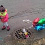 Children at Halloween near the drain haunted by Pennywise, the evil clown of Stephen King?s ?It.?