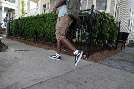 A young man walked past the area where Charlene Holmes, was killed on Willow Street in Cambridge.
