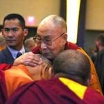 The Dalai Lama greeted and blesseed Tibetan monks before speaking to a crowd at the Sheraton Boston. 