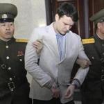 Otto Warmbier (center) was escorted during a March 2016 court hearing in Pyongyang, North Korea. 