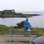 Visitors to Kennebunkport used the summer estate of George H.W. Bush, the 41st president, and his wife, Barbara Bush, as the background for their photos. Tourists often stream down Ocean Drive to gaze at the Walker?s Point residence.