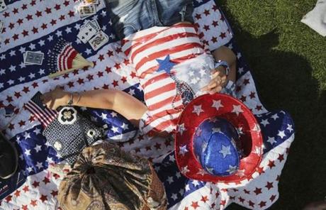 SLIDER. Boston, MA- July 04, 2017: Jackie Magner relaxes on the lawn before the Boston Pops Fireworks Spectacular in Boston, MA on July 4, 2017. (CRAIG F. WALKER/GLOBE STAFF) section: metro reporter:
