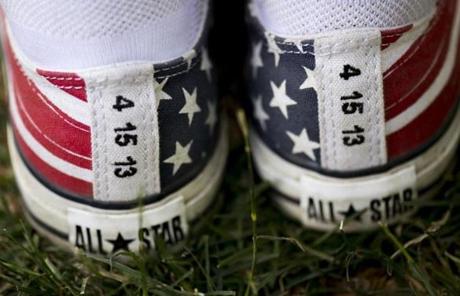 SLIDER. Boston, MA - 7/4/17 - Ritajayne Rivera, with American themed sneakers with the date of the Boston Marathon bombing written on them during the Fourth of July Pops celebration on the Esplanade on Tuesday, July 4, 2017. Rivera was near the first bomb during marathon. (Nicholas Pfosi for The Boston Globe) Topic: 05IndepenceDaypic
