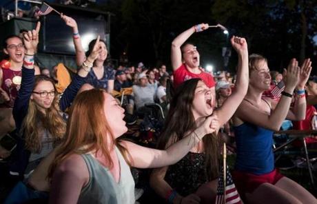 SLIDER. Boston, MA - 7/4/17 - From left to right, Erin McNamara, Danielle Morency, and Jennifer Ives and their friends celebrate Melissa Etheridge during the Fourth of July Pops celebration on the Esplanade on Tuesday, July 4, 2017. (Nicholas Pfosi for The Boston Globe) Topic: 05IndepenceDaypic
