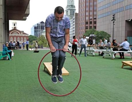 Connor Bradley jumped through a hoop during his lunch break at City Hall Plaza last week.
